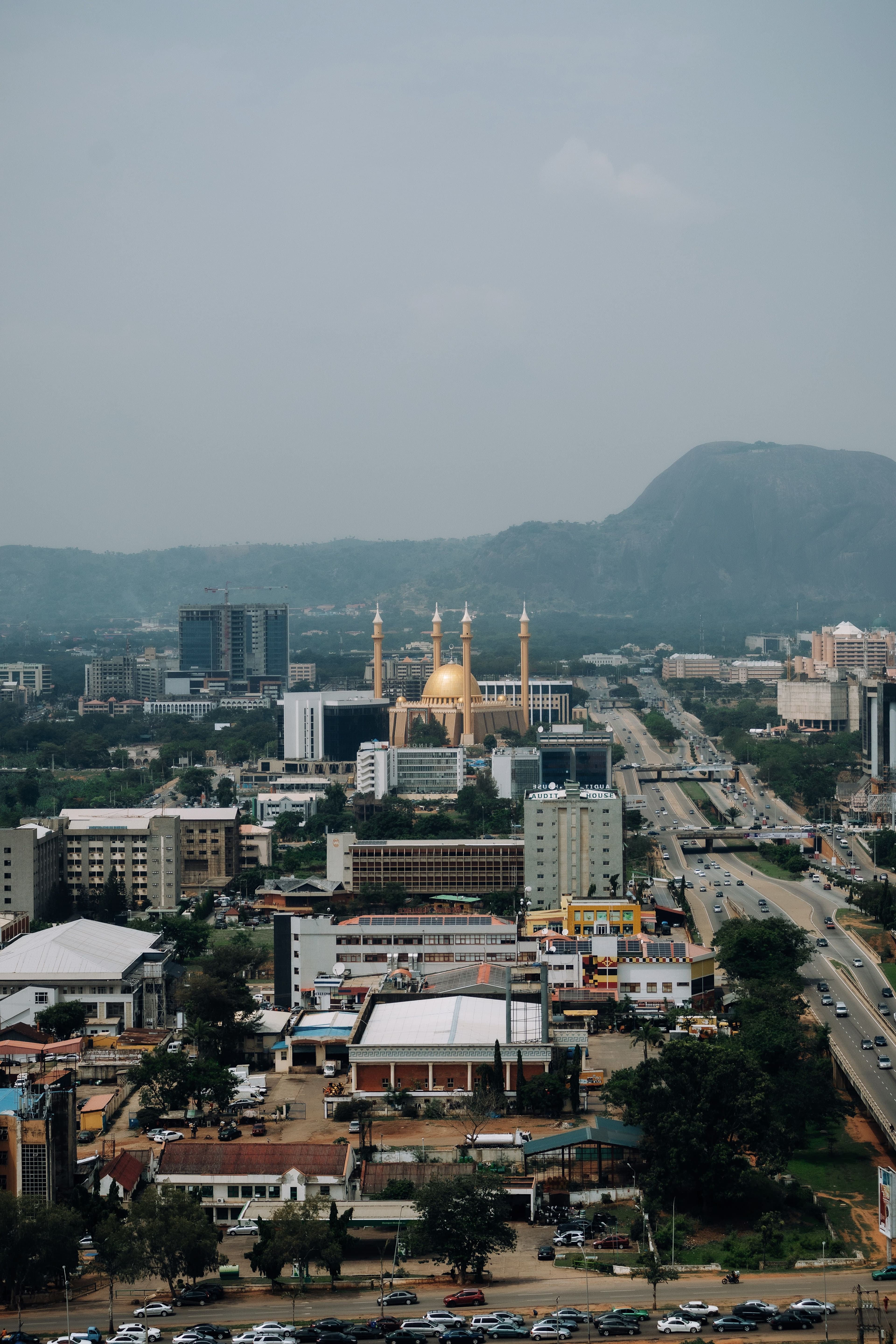 A panoramic view of Abuja's skyline with modern buildings