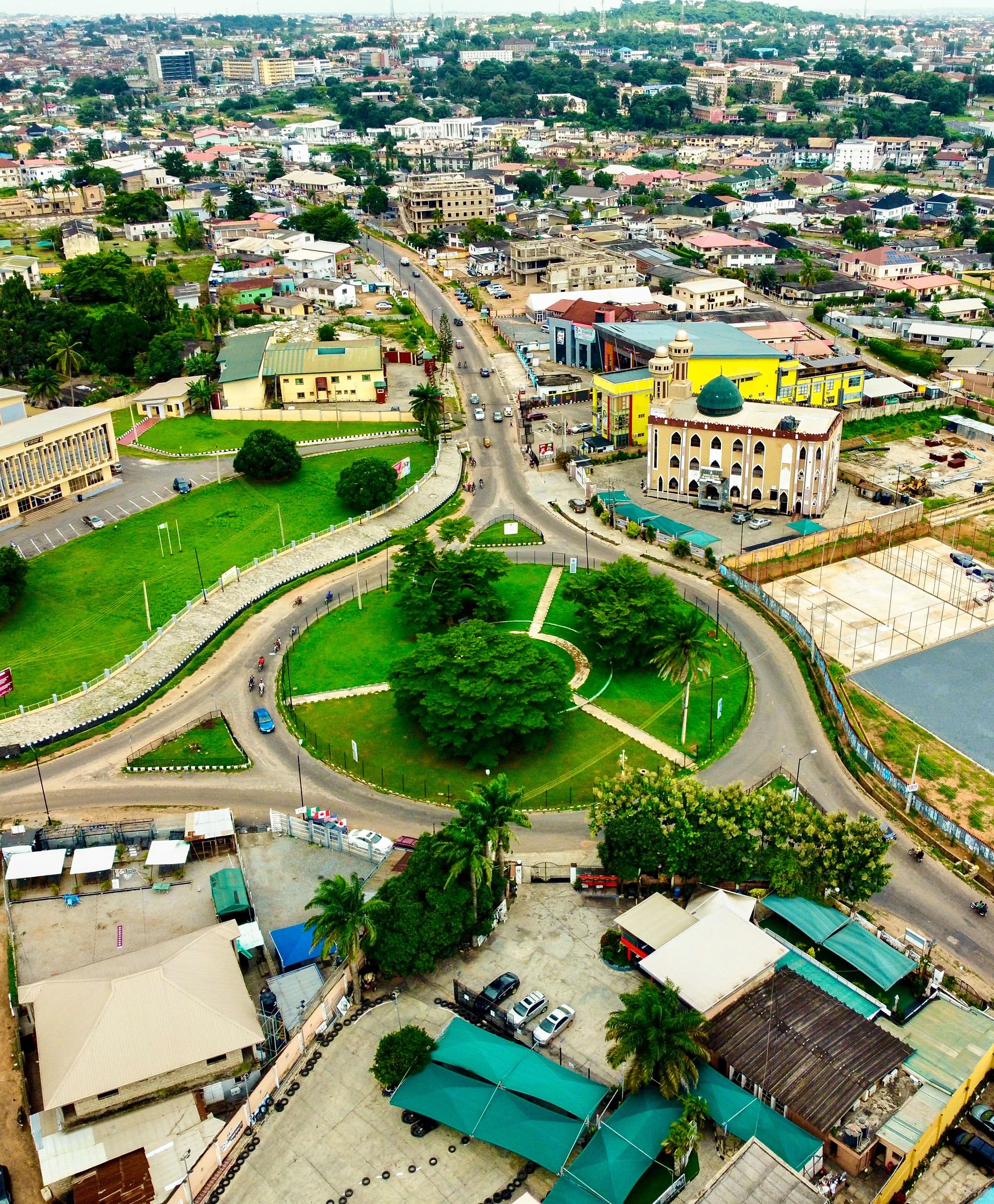 A modern Nigerian residential estate viewed from above, showing homes, roads and surrounding infrastructure.
